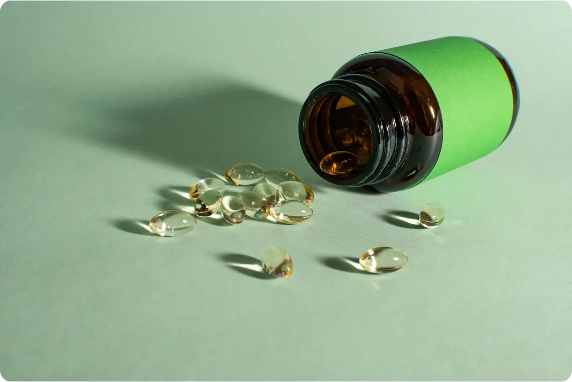 An open bottle of gel capsules