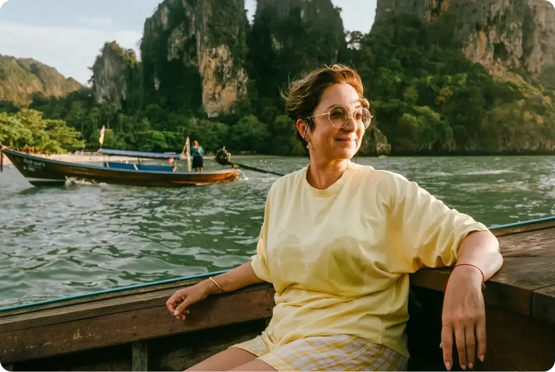 Woman sitting by the water.